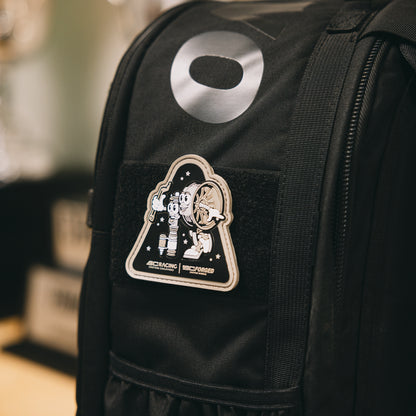 PVC patch of BC Racing wheel and coilover characters on a black backpack