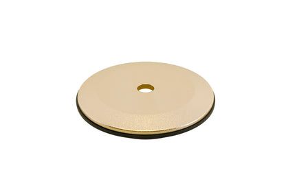 Gold BC Racing upper spring seat with black isolator on white background